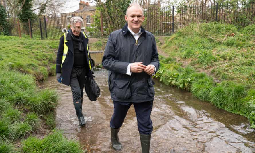 Paul Kohler, a Merton councillor and parliamentary candidate, follows the Lib Dem leader, Ed Davey, in the River Wandle.