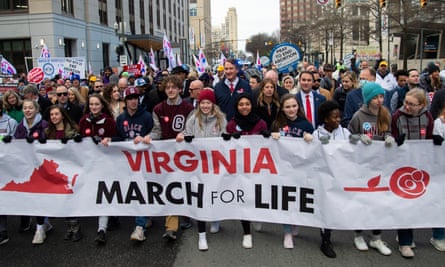 Glenn Youngkin marches with attendees at a March for Life event in Richmond, Virginia.