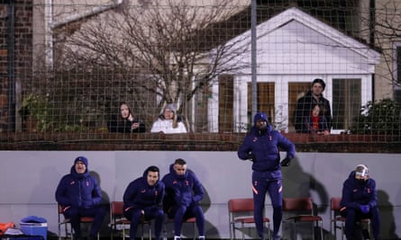 José Mourinho watches with his backroom staff and Rossett Road residents