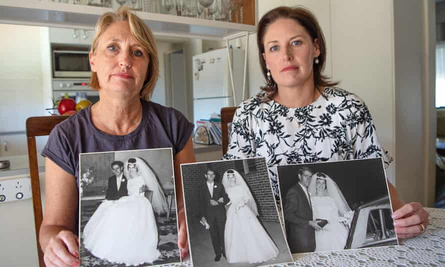 Jeanette and Michael Ryan’s daughters Dr Joanne Bowmaker (left) and Dr Olivia Mitchell in their parents’ house, with their parents’ wedding day photos from May 1963