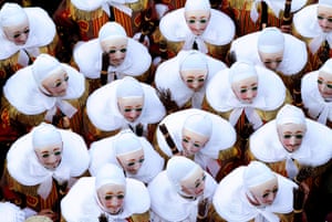 ‘Gilles of Binche’ dance during a carnival parade in the city centre of Binche, Belgium.