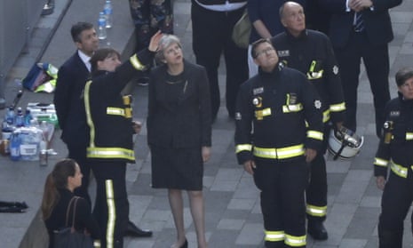 Theresa May speaks to members of London fire brigade