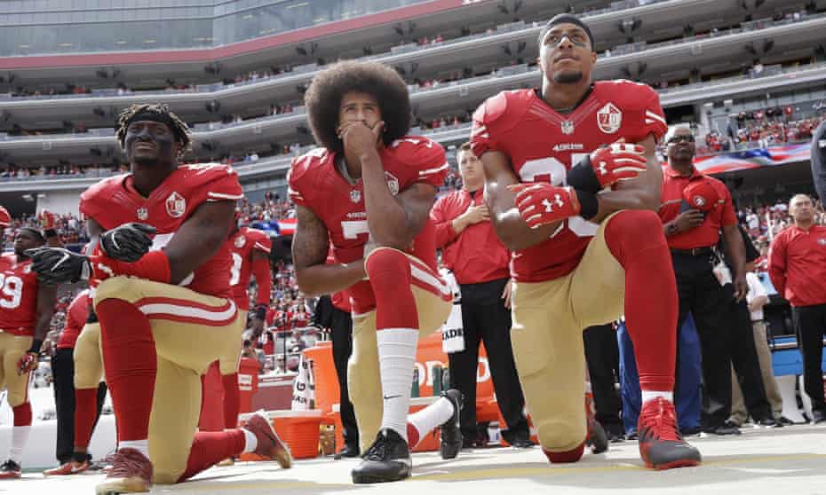Colin Kaepernick and his San Francisco 49ers team-mates ‘take the knee’ during the US national anthem, in protest of police killings