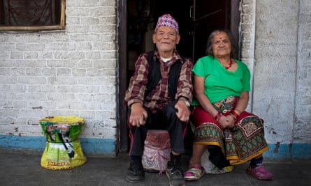 Harka Bahadur Chettri, 75, sits with his wife Sabitri Chettri, 73, outside their room in the Khokana lepers colony.