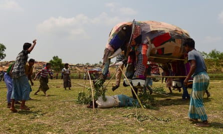 Rohingya refugees at the Kutupalong refugee camp are trained in how to deal with an elephant encounter