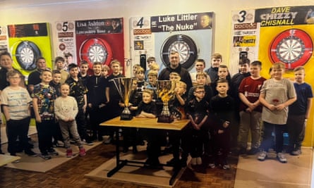 Luke Littler and other members of the St Helens Darts Academy.