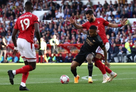Arsenal's Gabriel Jesus (centre) shields the ball from Nottingham Forest's centre back Felipe during the Premier League game between Nottingham Forest and Arsenal at The City Ground.