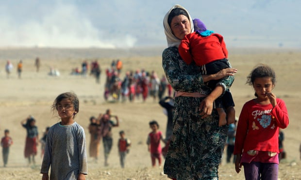 Displaced Yazidi people fleeing violence from Isis forces in Sinjar town.