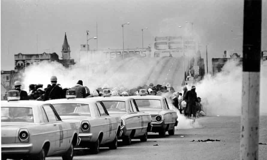 Tear gas fumes fill the air as state troopers, ordered by Governor George Wallace, to break up a demonstration march in Selma, Ala., on Bloody Sunday on 7 March 1965.