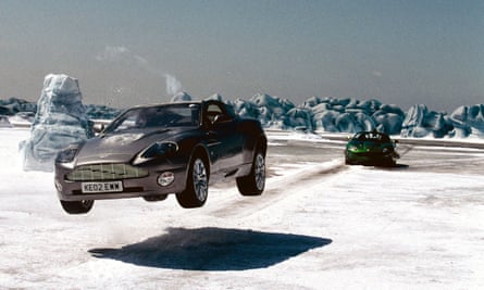 An Aston Martin leaps in the air on icy terrain