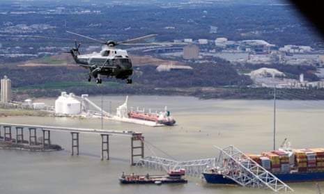 Joe Biden, aboard Marine One, takes an aerial tour of the collapsed Francis Scott Key Bridge in Baltimore, as pictured from an accompanying aircraft.