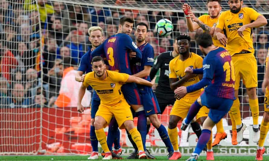 Lionel Messi scores the winner against Atlético Madrid despite Diego Costa’s leap in the wall.