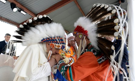 Pope Francis wears a headdress presented to him by Indigenous leaders in Maskwacis.