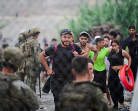 Migrants from Morocco arrive at the Spanish border, in Ceuta, Spain.