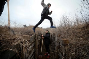 Chervone, Ukraine: Teenagers dig trenches for soldiers serving on their country’s eastern front and facing off with Russian-backed separatists