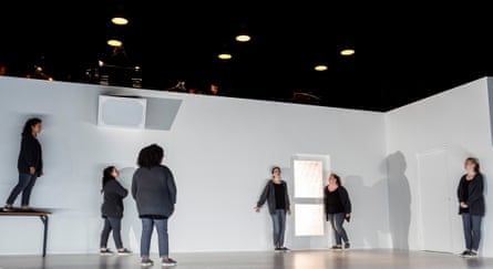 In 4.48 Psychosis, six performers stand apart on a bare white stage, one speaking with arms outstretched
