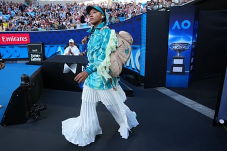 Naomi Osaka walks on to court