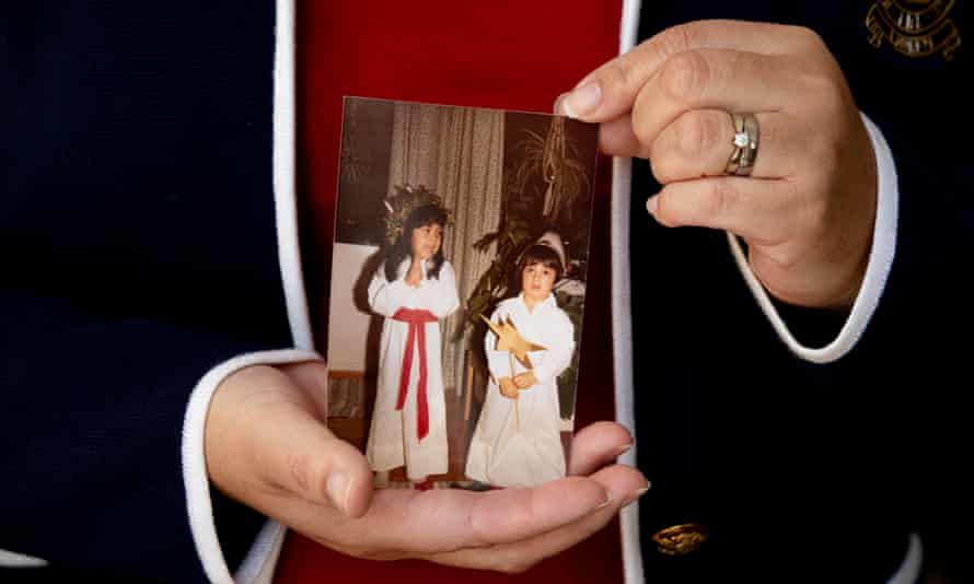 Maria Diemar holds a photograph showing her with her brother, Daniel Olsson.