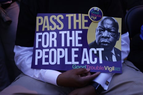 At a vigil for lawmaker and civil rights activist John Lewis, attendees urge passage of the For the People Act.