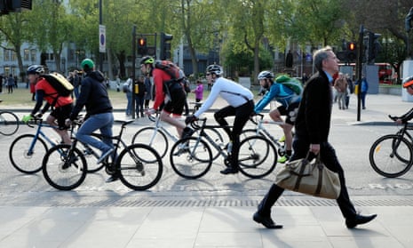 Cyclists and a pedestrian in central London