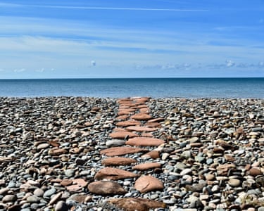 Nethertown, Cumbria, UK I came across this little path made from pieces of red sandstone embedded into the grey shingle while walking a section of the Cumbria coastal path.’