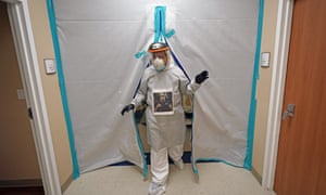 Dr. Joseph Varon walks through one of sealed entrances at the Coronavirus Unit at United Memorial Medical Center, Houston