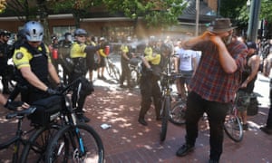 Police use pepper spray as multiple groups protest in downtown Portland.