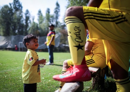 Emmanuel Dela Rosa, 2, looks up astatine his begetter during an amateur convention game
