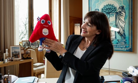 The mayor of Paris, Anne Hidalgo, with a toy mascot for the 2024 Summer Games.
