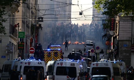 Protesters clash with riot police at the Porte d'Aix in Marseille on Friday