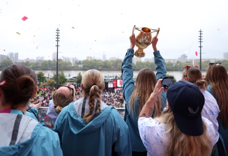 Jess Breach of England lifts the trophy on the balcony.