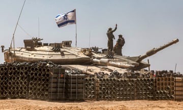 Tank with two people on top and Israeli flag