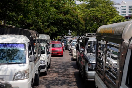 Drivers wait to buy fuel outside a petrol station in Yangon, Myanmar on 19 April 2022.