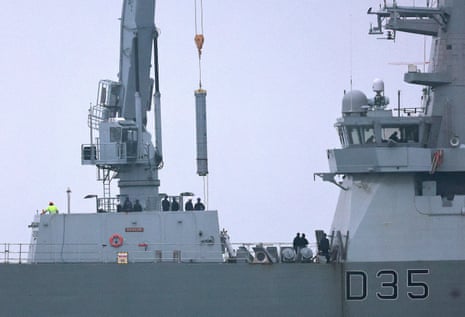 Equipment is loaded on to HMS Dragon, a Royal Navy destroyer on Monday, in preparation for it sailing to the eastern Mediterranean.