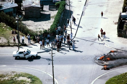 Aerial view of people and a vehicle at a crossroads