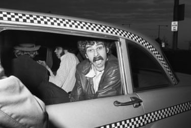 a man rides in a taxi