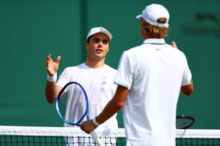 Arthur Fery on court with Cruz Hewitt at Wimbledon.