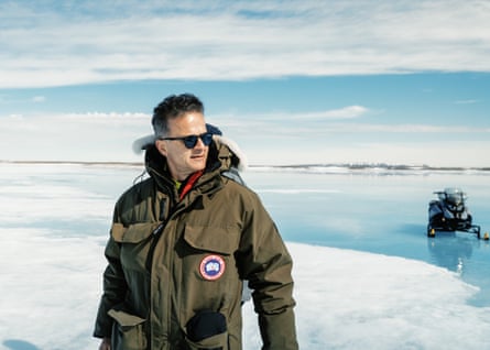Andrea Ceccolini wearing a winter coat and sunglasses on the ice