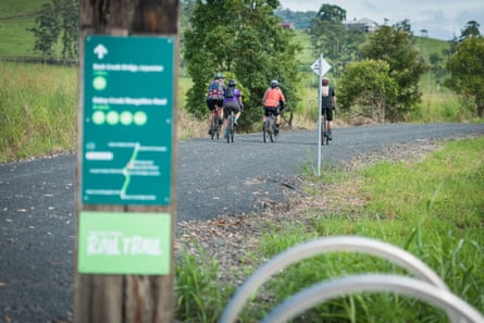 A group of people riding bikes on a rail trail