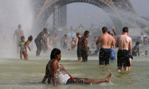 Parisians and tourists try to escape the July 2019 heatwave in the Trocadéro fountains across from the Eiffel tower.