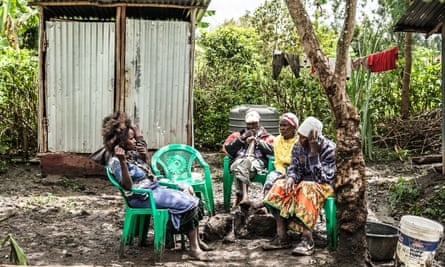 Mourners gather at the home of Samuel Mutisya Kandie in Murang’a County, Kenya, for a funeral vigil for his son. Brian Otieno/The Guardian