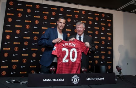 Van Persie poses alongside Sir Alex Ferguson after signing from Arsenal