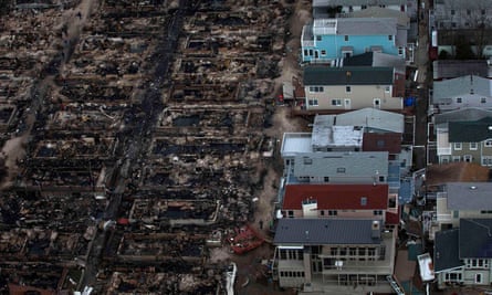 Burned houses are seen next to those which survived in Breezy Point, a neighborhood located in the New York City borough of Queens, after they were devastated by Hurricane Sandy October 31, 2012.
