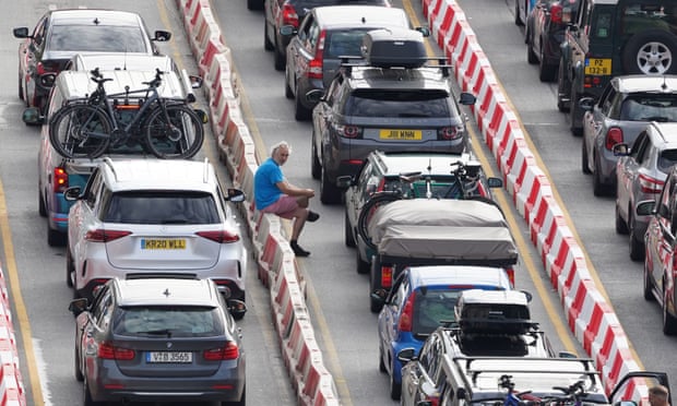 Cars queue to enter the port of Dover in Kent, 28 July 2022.