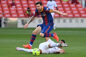 Lionel Messi hurdles Casemiro’s lunge.