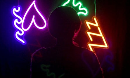 Silhouette of a woman in front of neon lights