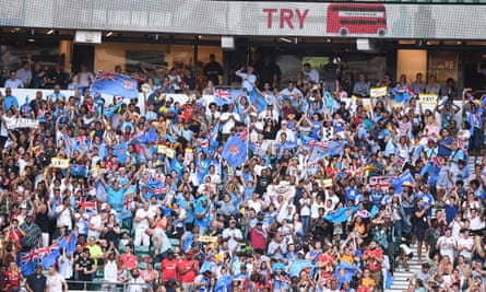 Fiji fans cheer a try from their team.