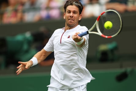 Cameron Norrie plays a forehand return to Frances Tiafoe.