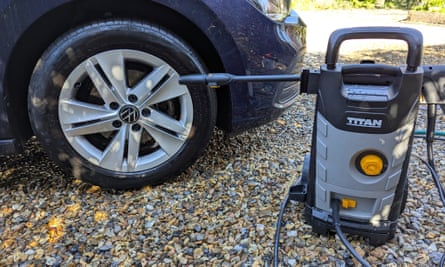 The Titan TTB1800PRW pressure washer sitting next to a car tyre it has just cleaned