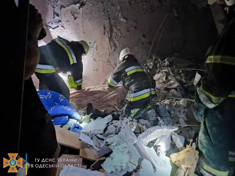 Emergency crews work to recover people from the wreckage after a missile hit an Odesa apartment building.